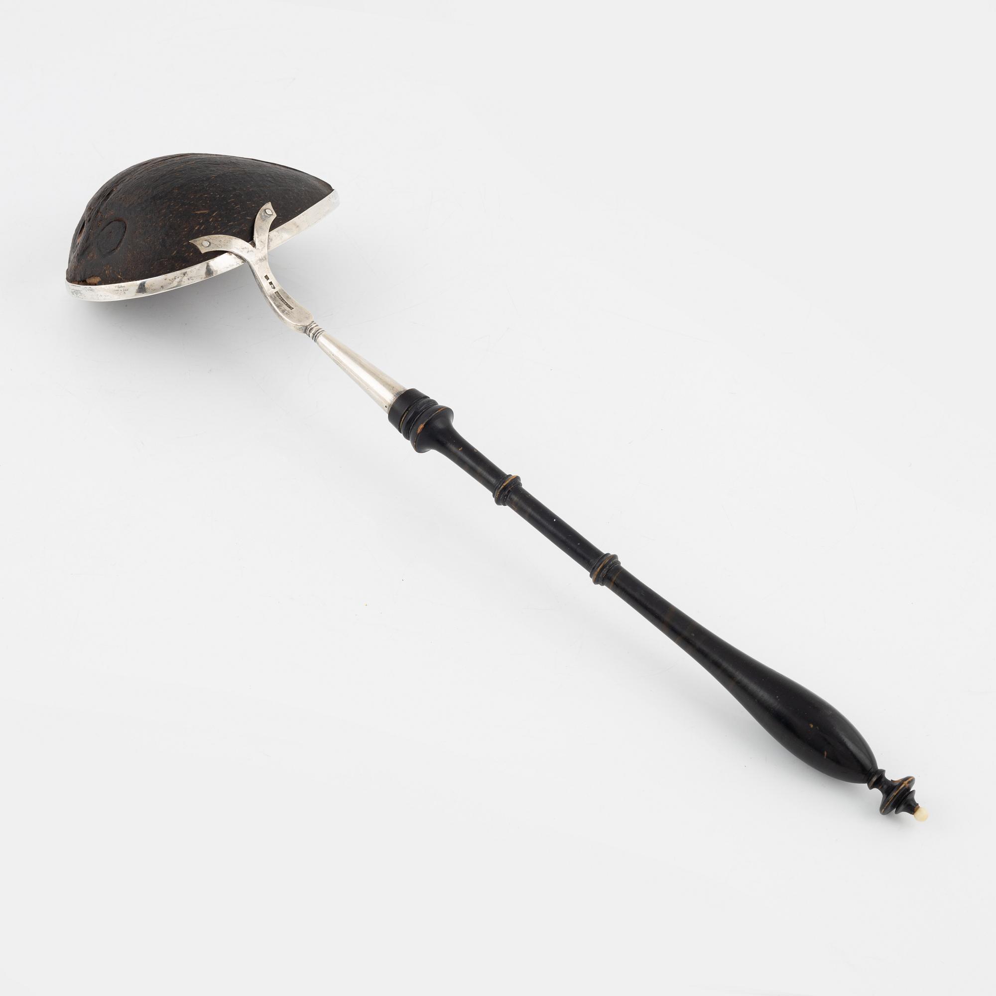 A silver mounted soup ladle with a coconut cup.