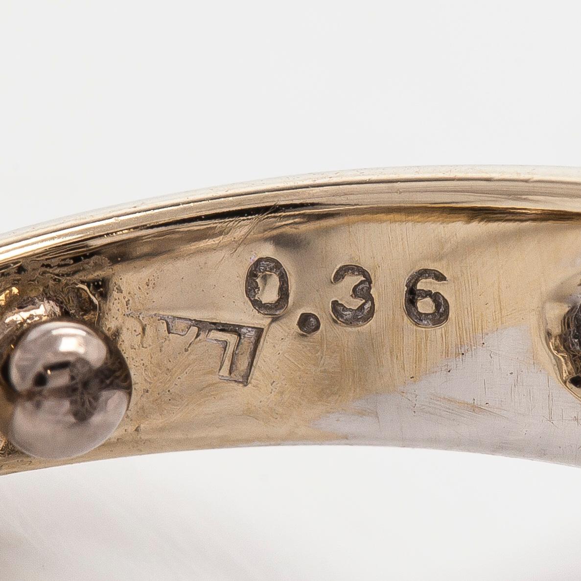 Sormus, musta ja valkoinen onyksi briljanttihiotut timantit.