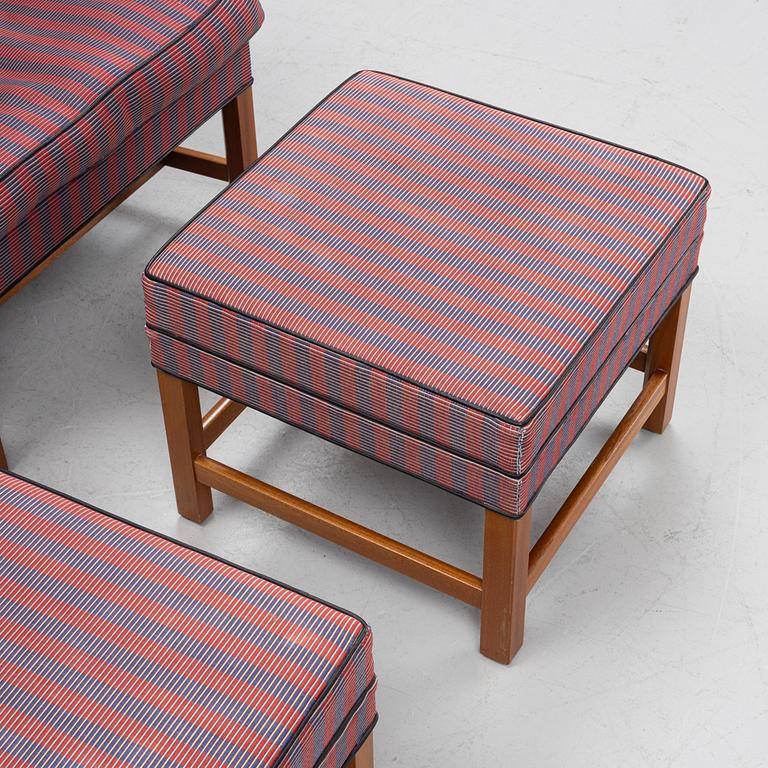 Kaare Klint, a pair of model 6212 armchairs with ottomans, Rud Rasmussen, Denmark.