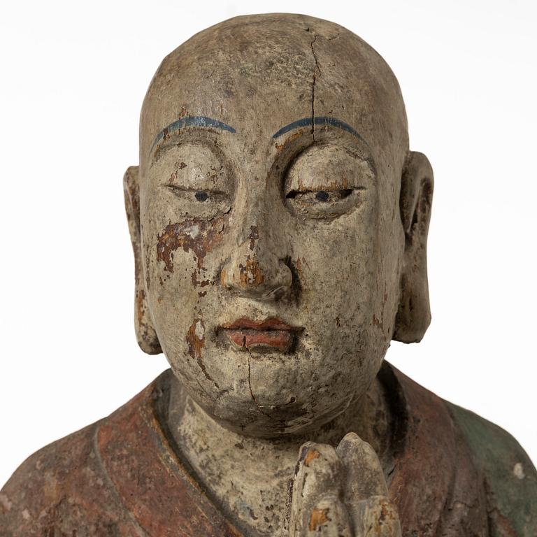 A Chinese sculpture of a louhan, 20th century.