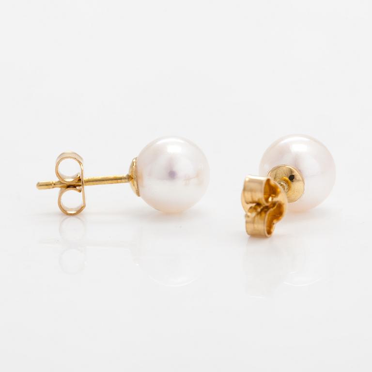 A pair of 18K gold eand cultured pearls earrings.