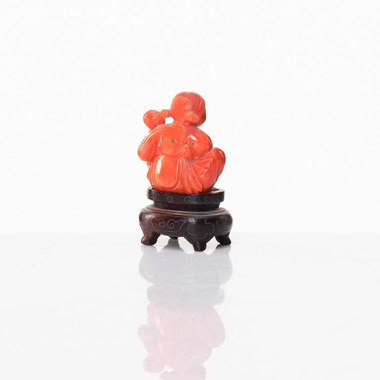 A Chinese enamel on copper coaster, a green stone bowl and a small stone figure, China, Qing dynasty and 20th century.