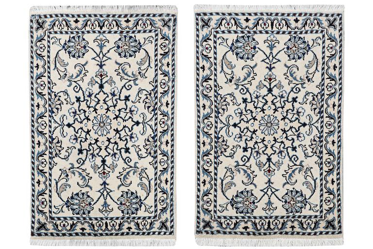 A pair of Nain rugs, part silk, c. 88 x 57 cm & c. 89 x 57 cm.