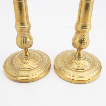 A pair of 19th century brass candle sticks.