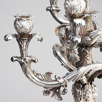 A pair of Swedish mid 19th century silver candelabra, marks of Gustaf Möllenborg, Stockholm 1844.