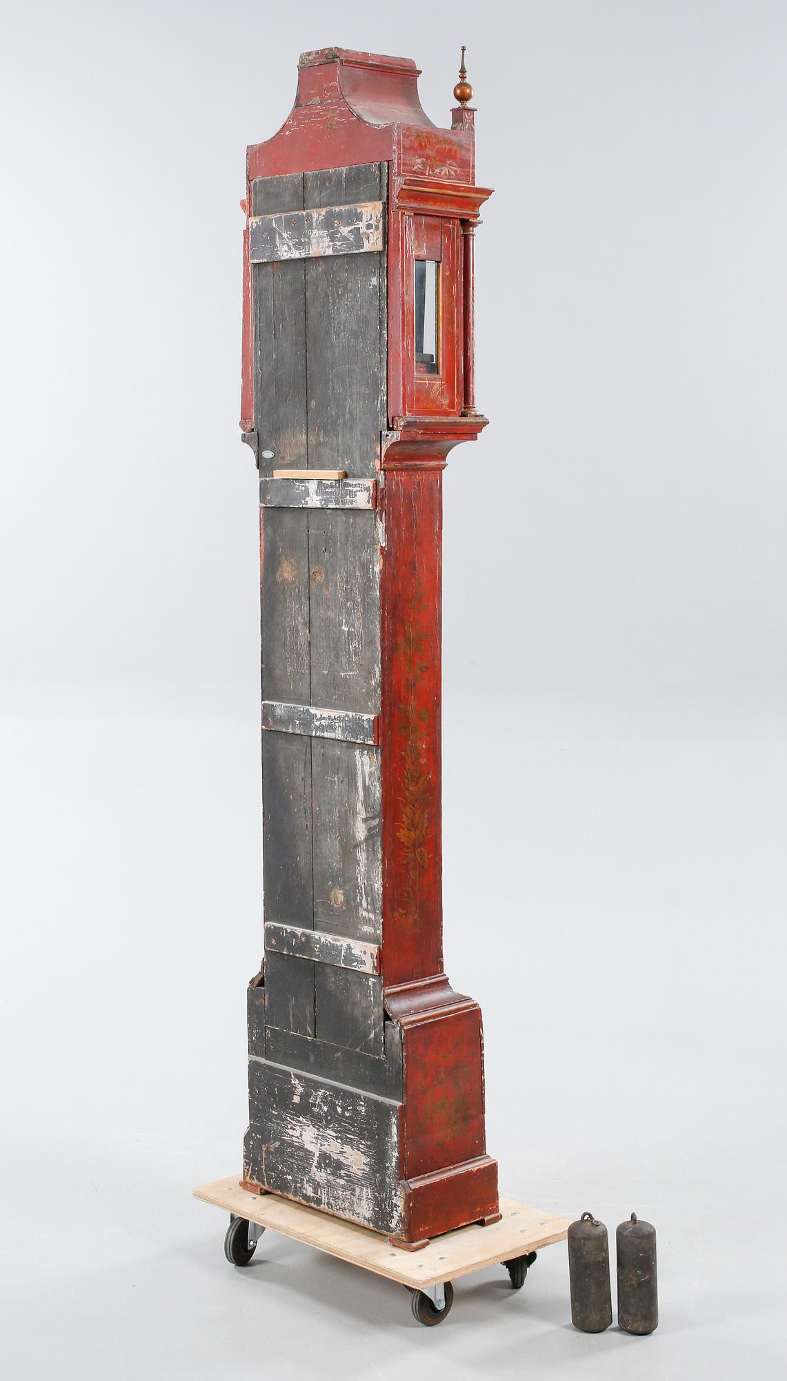 A grandfather clock, dial marked "John Thompson, England", 19th century.