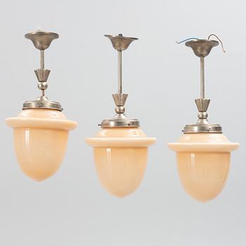 Three Swedish Grace ceiling lamps, 1920's.