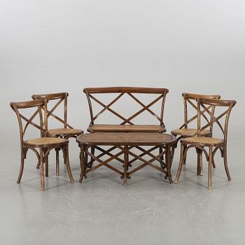 A wooden sofa, a table and four chairs, later part of the 20th century.