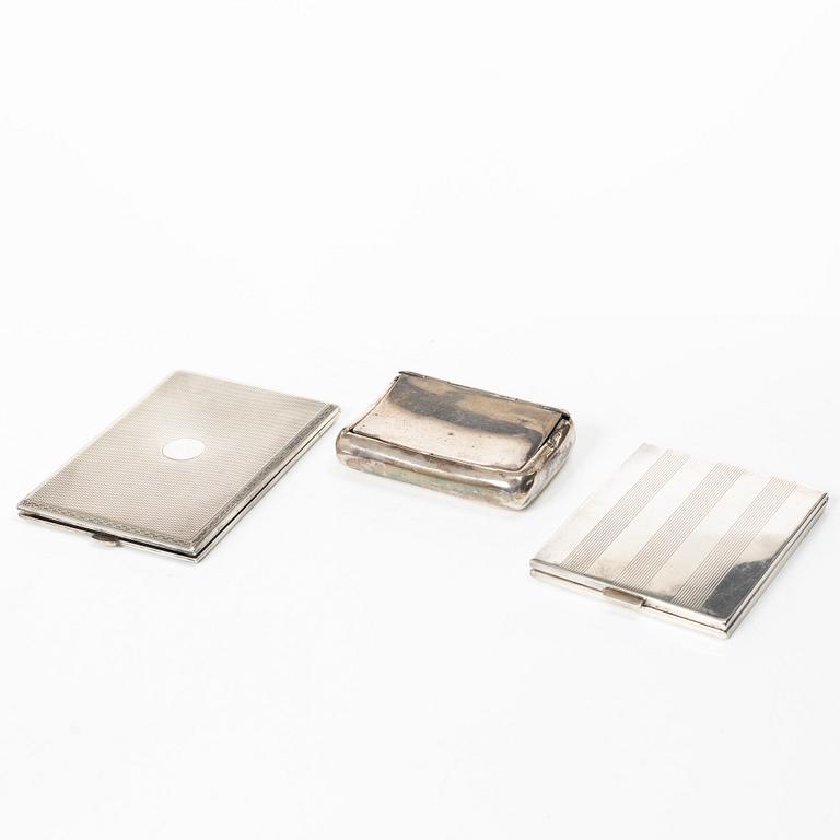 Two cigarette cases and a snuffbox, silver, Sweden and Swedish import marks respectively.