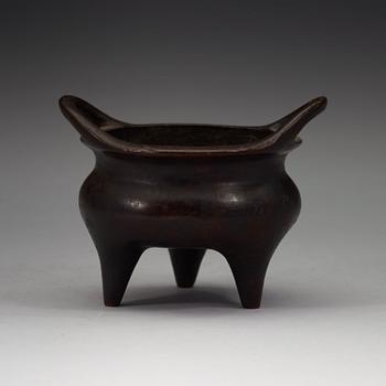 A copper alloy tripod censer, Ming dynasty, 17th Century with Xuandes four character mark.