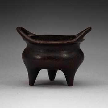 A copper alloy tripod censer, Ming dynasty, 17th Century with Xuandes four character mark.