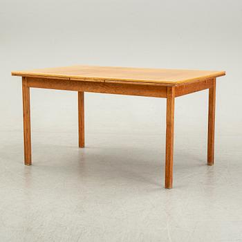 Knud Andersen, a set of six chairs for J.C.A Andersen, Aarhus, Denmark and a dinner table from Troeds, Bjärnum.