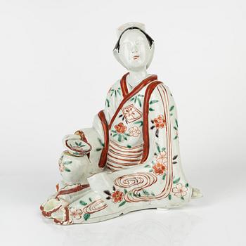 A Japanese porcelain figure, 18th century.