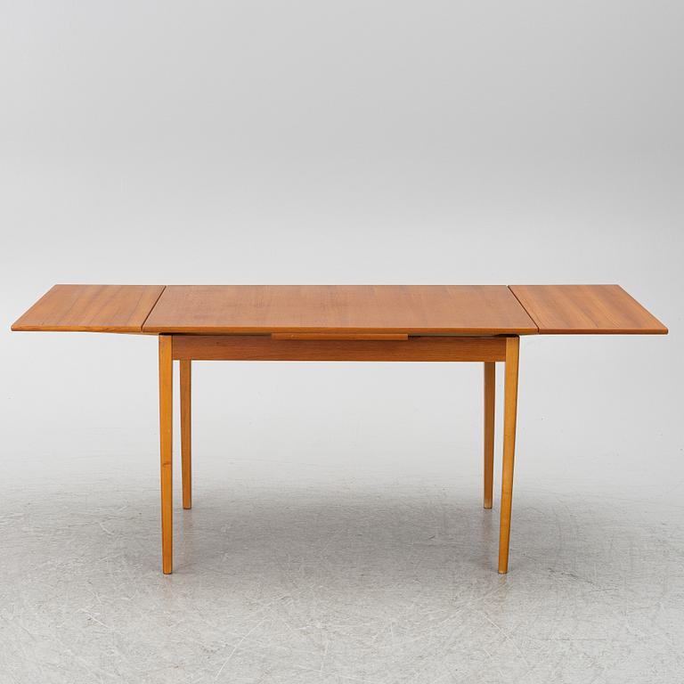 A mid20th century dining table.