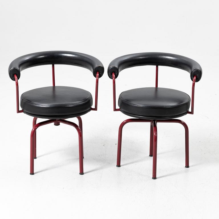 Charlotte Perriand, /Le Corbusier, swivel armchairs, a pair, model LC7, Cassina, Italy, latter half of the 20th century.