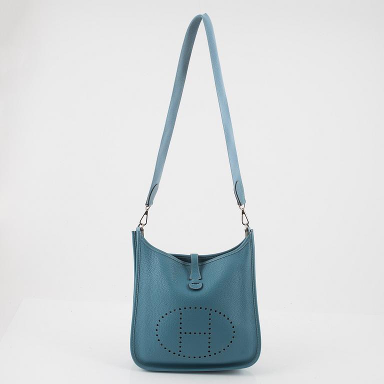 Hermès, A blue Taurillon Clemence leather Evelyn bag, 2008.