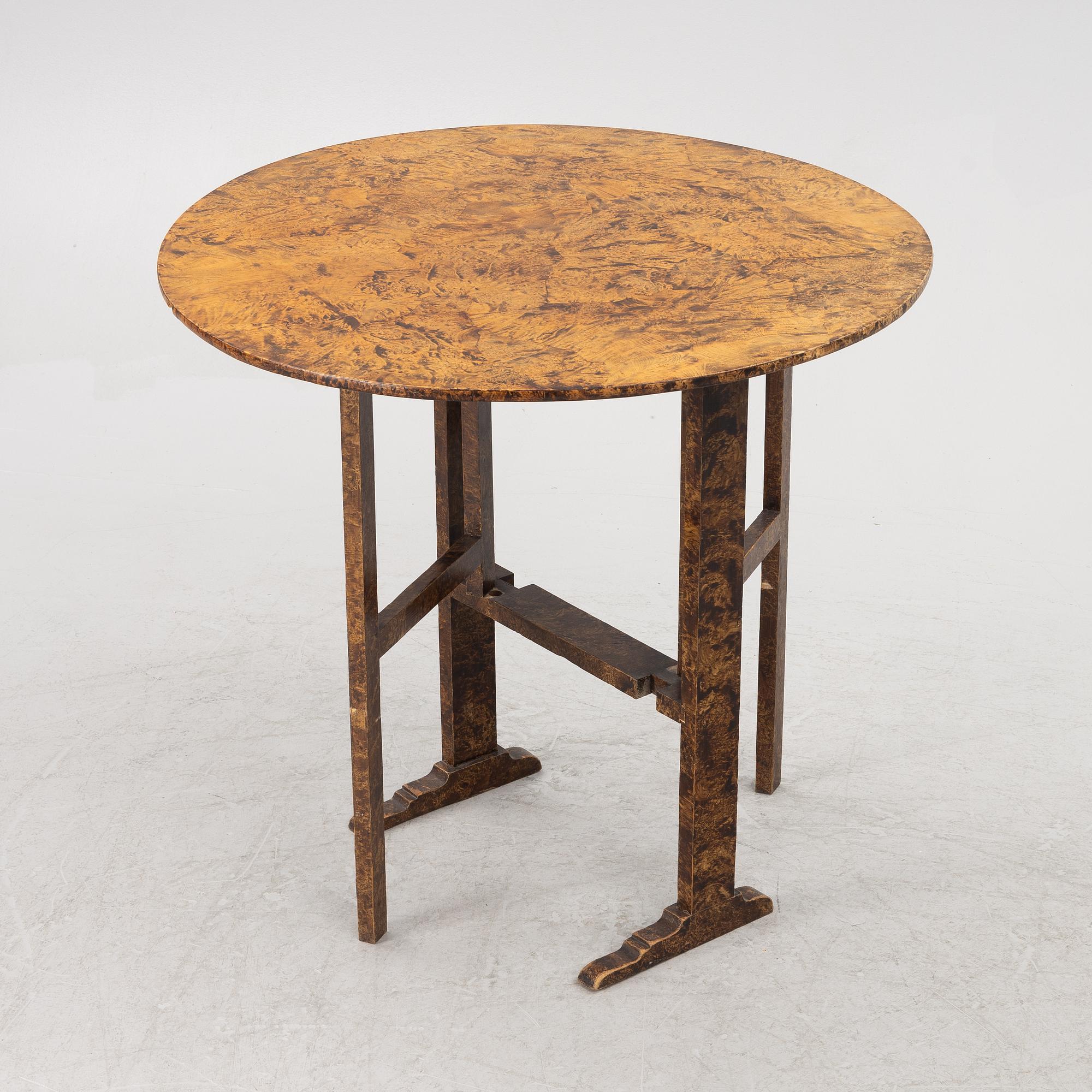 A folding table, 19th Century.