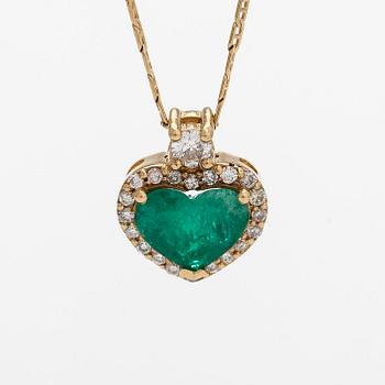 An 18K gold necklace and pendant with heart-shaped emerald and diamonds.