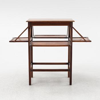 An English mahogany table, early 20th Century.