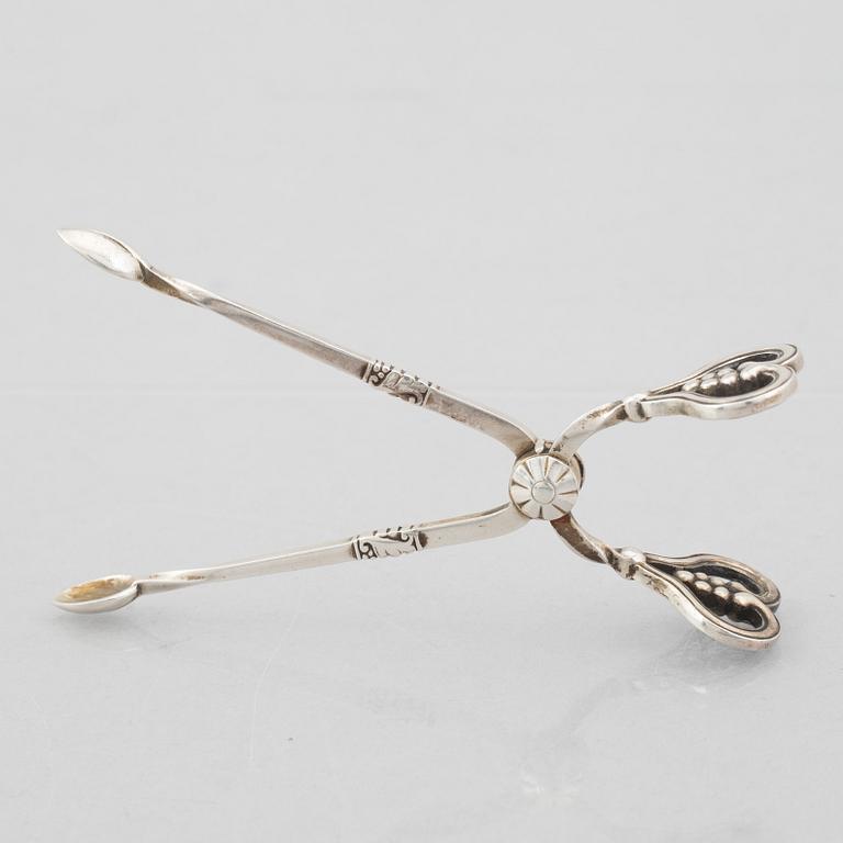 A sterling silver sugar tongs, mark of Georg Jensen, Denmark 1933-44.