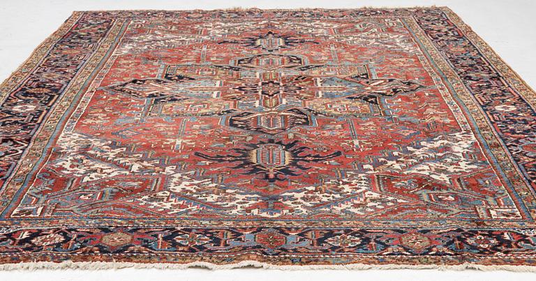 A semi-antique Heris carpet, west persia c. 322 x 252 cm.