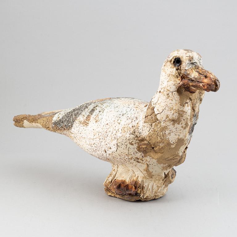 A stoneware sculpture of a bird by Henrik Allert.