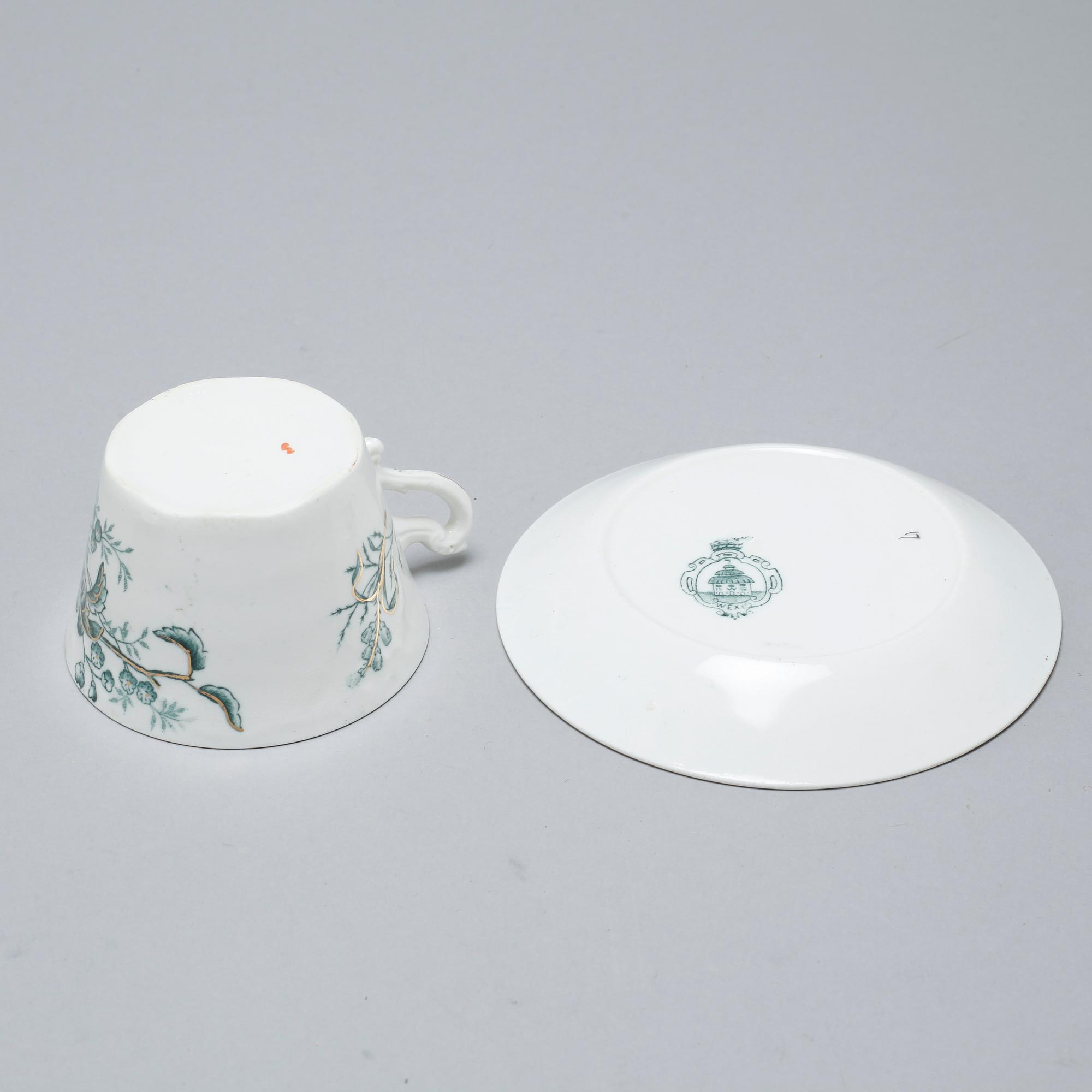 A earthenware table set of 136 pcs "Vexiö Guld",  by Arvid Ekberg, Gustafsberg, from around year 1900.