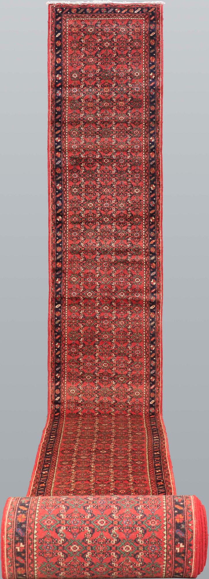 A Hosseinabad runner, approx. 1360 x 80 cm.