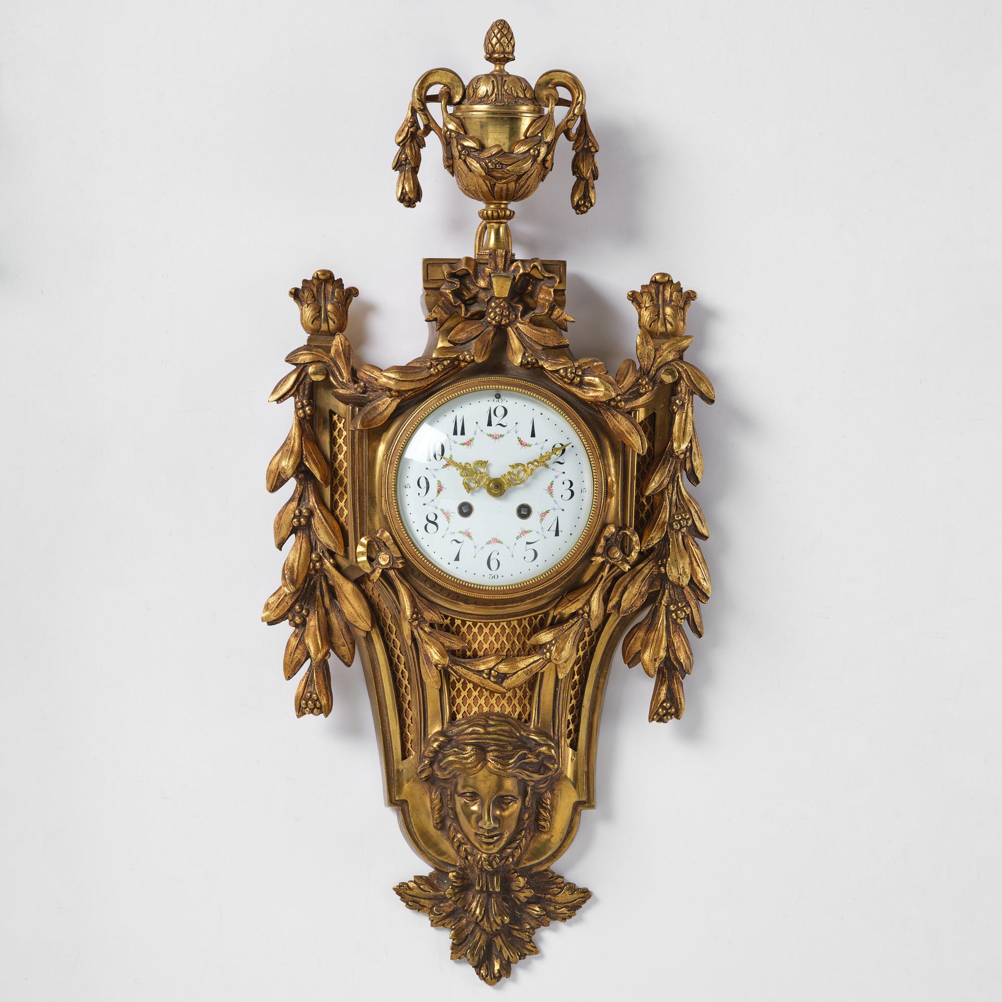 A French  Louis XVI-style wall clock, around 1900.