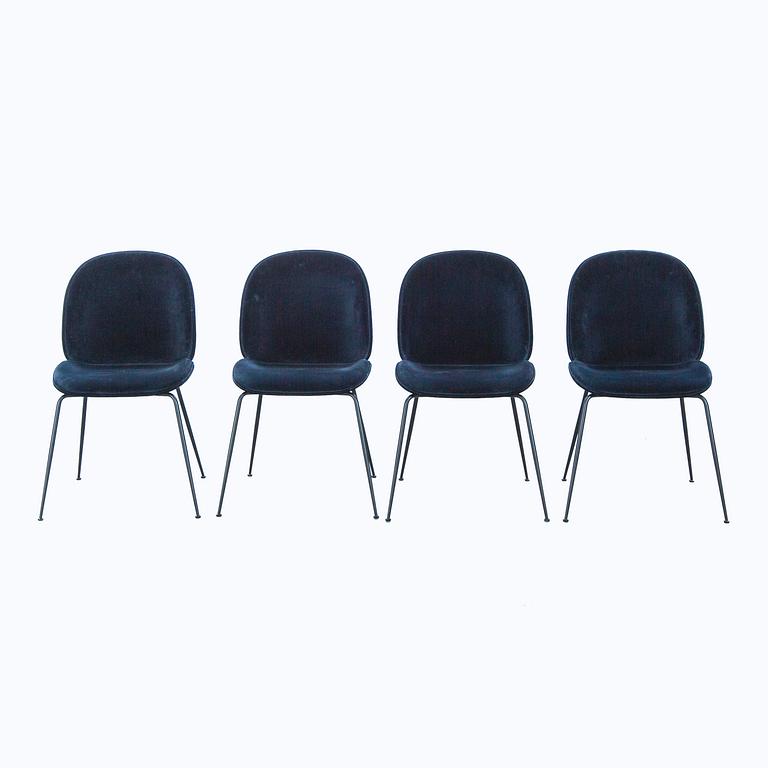 A set of four Beetle dining chairs by Gamfratesi for Gubi 2013.