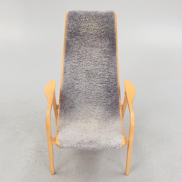 Yngve Ekström, a 'Lamino' armchair with a foot stool, Swedese.