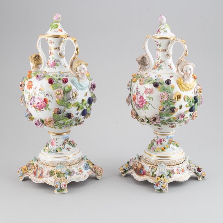 A pair of enamelled earthenware vases with covers, 20th century.