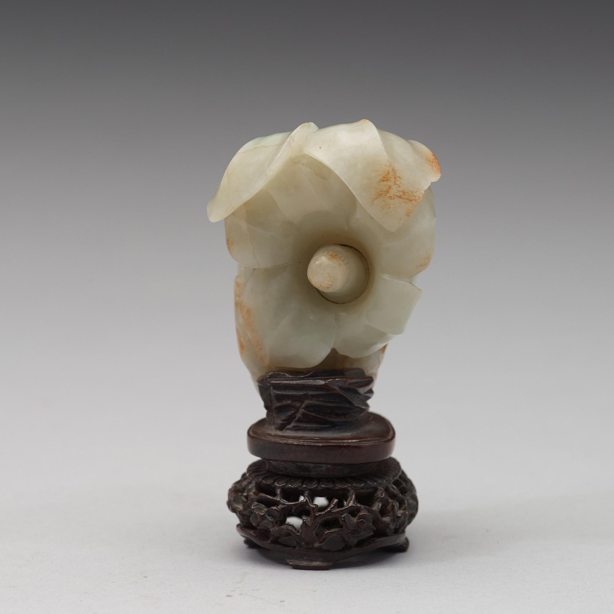 A celadon nephrite floral group, Qing dynasty (1644-1944).