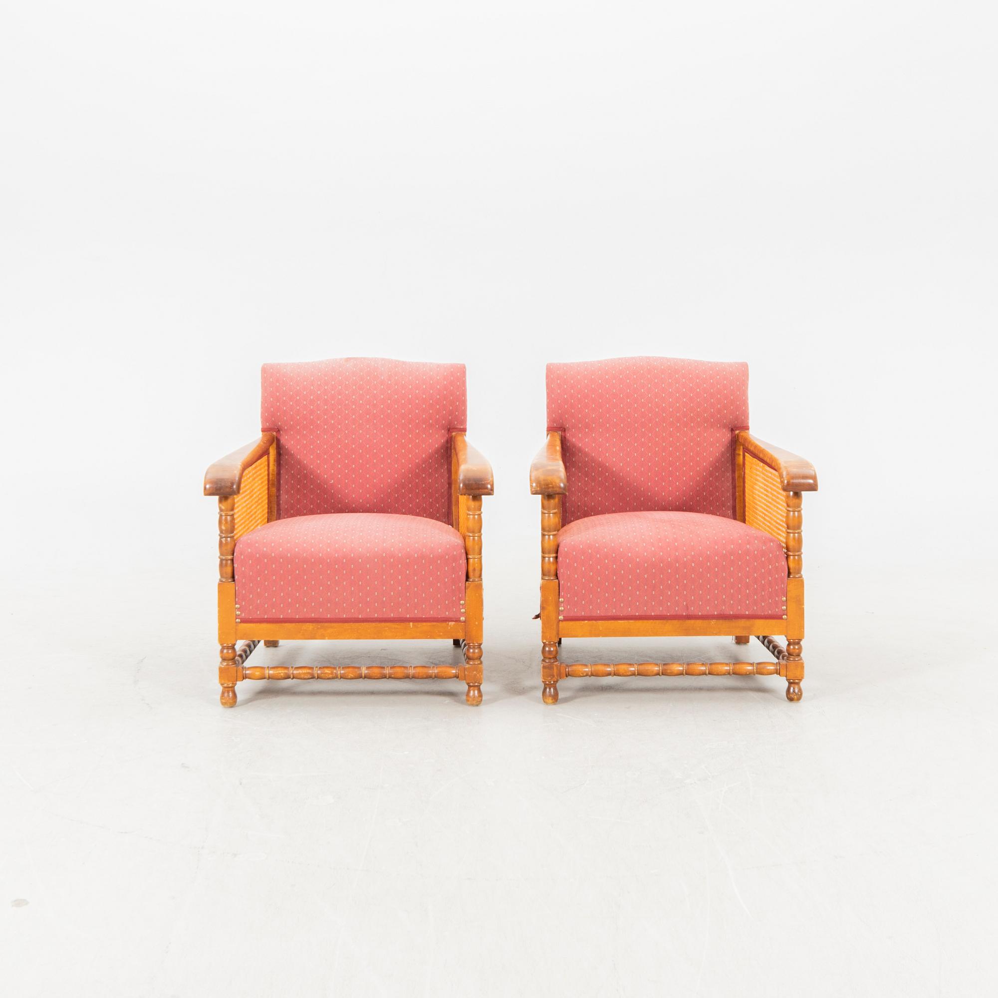 A pair of lacquered wood and rattan easy chairs from the middle of the 20th century.