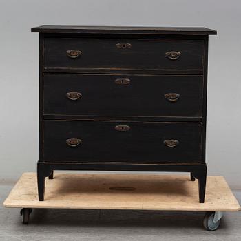 a chest of drawers from the first half of the 20th century.