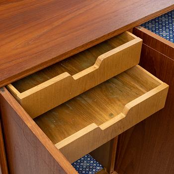 A teak-veneered mid 20th century sideboard.