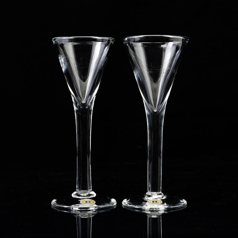 A set of twelve "Antik" shot glasses and two decanters by Reijmyre Glasbruk.