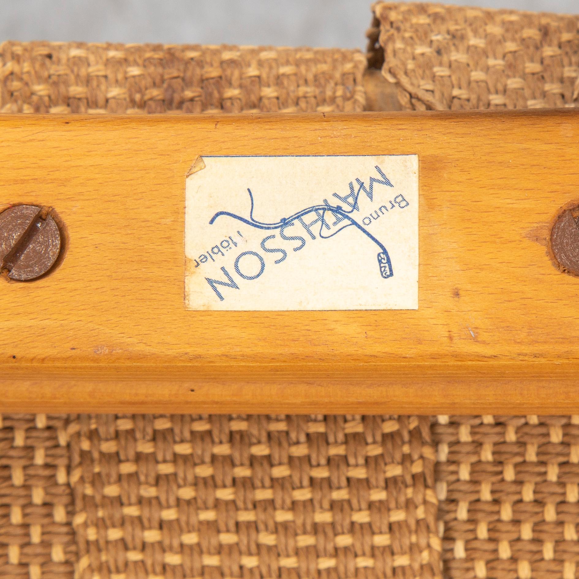 An mid 20th Century easy chair  and stool by Bruno Mathsson for Karl Mathsson Värnamo.
