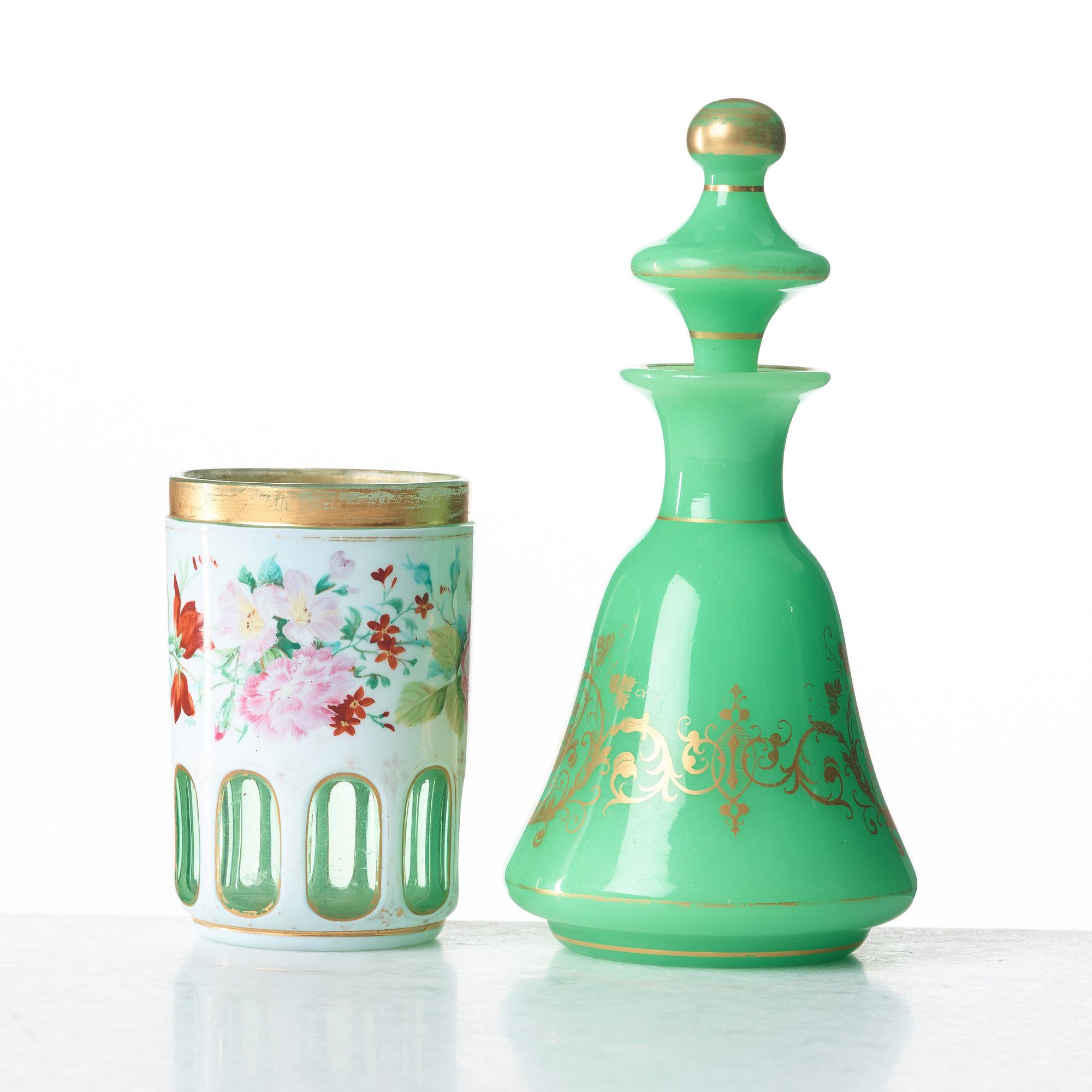 A green bottle with stopper and a beaker glass, Russia, 19th Century.