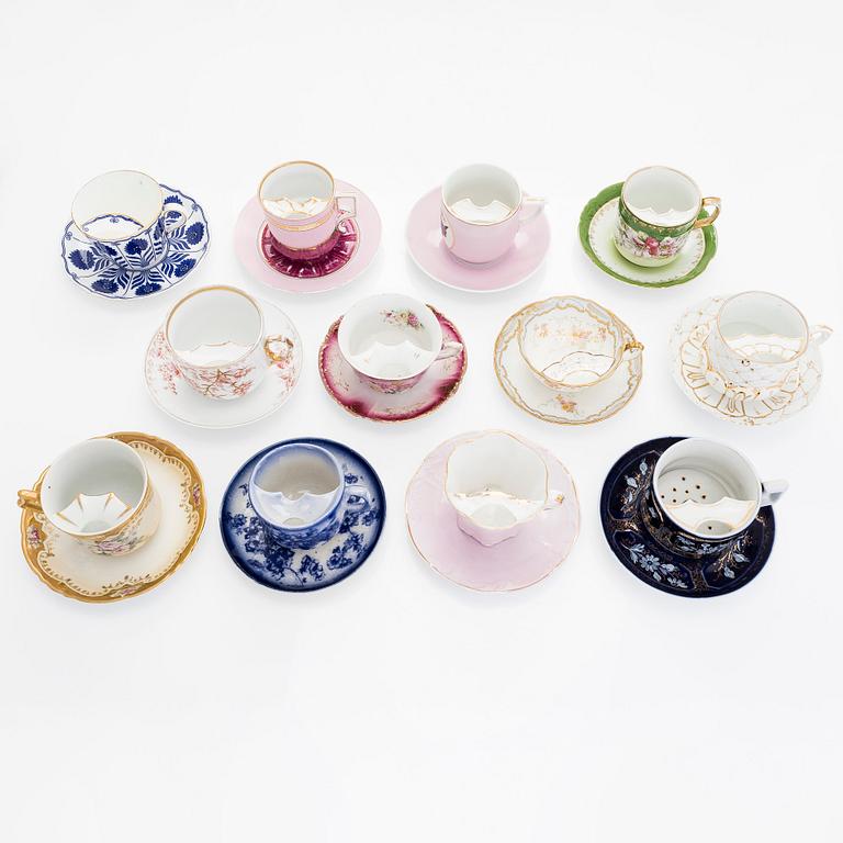 A set of 12 pair of porcelain mustache cups, including Germany, 19th and 20th century.