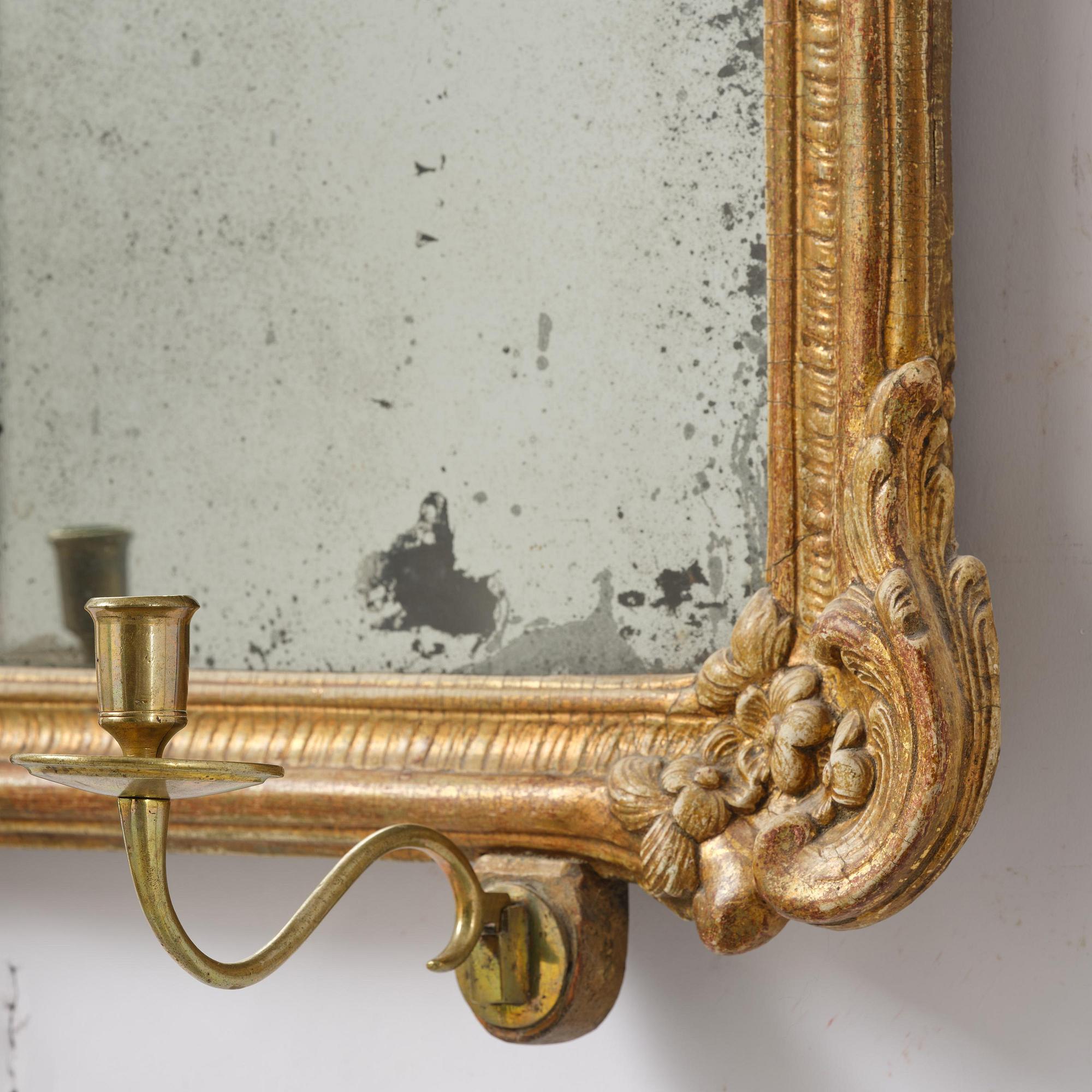 A two-branch giltwood rococo girandole mirror, Stockholm, later part 18th century.
