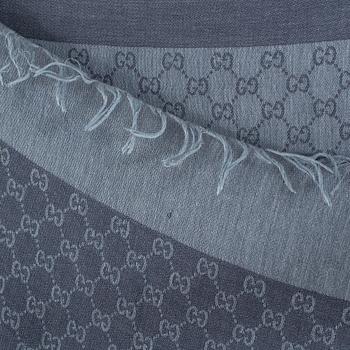 A shawl by Gucci.