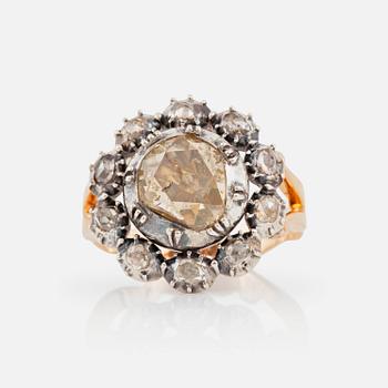 A brown and white rose-cut diamond ring.