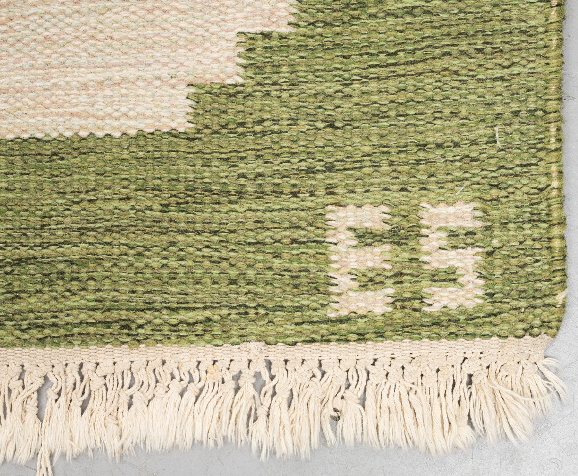 A carpet, flat weave, ca 241,5 x 172,5-175,5 cm, signed ES.