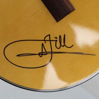 Jill Johnson, a signed acoustic guitar.