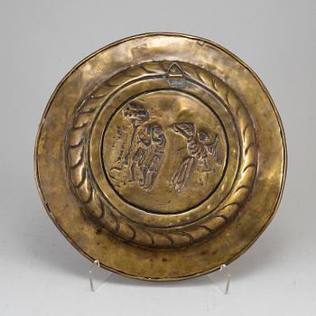 A renaissance style brass dish, late 19th century.