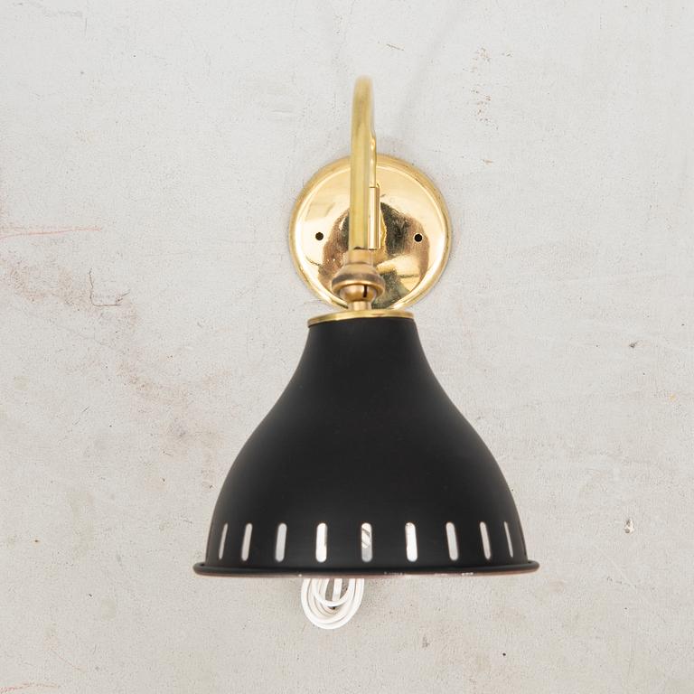 A bras wall lamp later part of the 20th century.