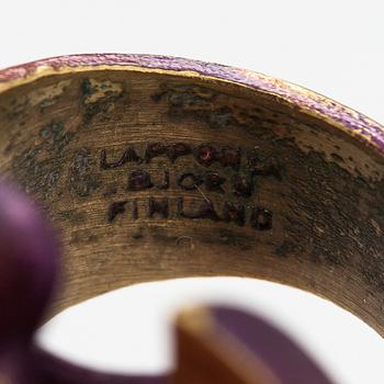 Björn Weckström, A flame bronze necklace "International arms Inc" and ring "Henry J". Lapponia.