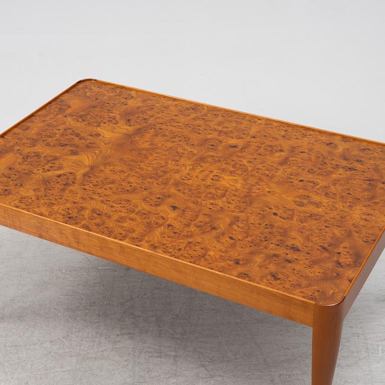 A Josef Frank mahogany and elm root model 2073 coffee table, designed 1949.