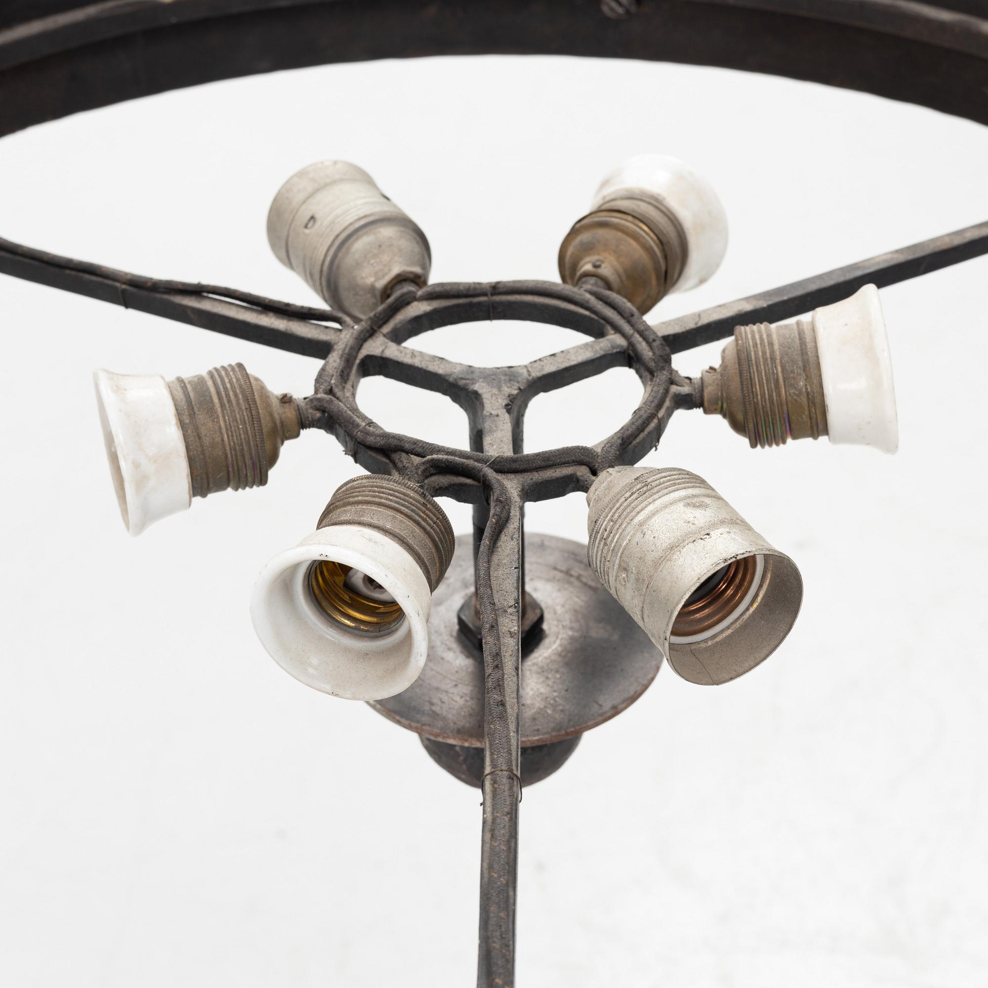 A moose horn and cast iron chandelier from around 1900.